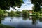 Beautiful view at pond in Zwierzyniec, Roztocze, Poland. Park and famous St.John\\\'s of Nepomuk Church on the island in the