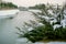 Beautiful view of the Porsuk river with a small bridge over it in snowy winter, Eskisehir, Turkey