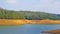 Beautiful view of Pykara Lake, Ooty, Tamilnadu during sunset. Awesome scenery of landscapes of sky,water,sunset and green bushes