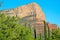 Beautiful view of red rock mountains with green trees at the foot in Sadona desert town, Arizona