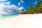 Beautiful view of the resort on Mauritius. Transparent ocean, white sand, palms and sky