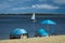 Beautiful view of the resort options, sports boat and tents with sun umbrellas on the beach