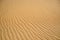 Beautiful view of rippled sandy surface in desert as background