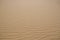 Beautiful view of rippled sandy surface in desert as background