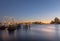 Beautiful view of the river and Boston skyline at sunset with a moored schooner. Massachusetts.