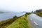 Beautiful view of the road along the shore of Looscaunagh Lough lake in County Kerry, Ireland