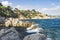 Beautiful view on rocky beach in Lloret de Mar, Costa Brava, Spain. Rocks and stones in sea on spanish coastline in Lloret