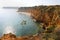 Beautiful view of rocky cliffs overhanging coast from Ponta da Piedade near Lagos, Algarve region, Portugal