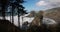 A beautiful view of a rocky shoreline with a forest in the background