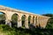 Beautiful view of roman Aqueduct Pont del Diable in Tarragona at sunset