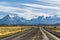 Beautiful view of rural road with golden yellow grass with background of nature cuernos mountains peak with cloud in autumn,