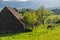 Beautiful view of Saint-Bonnet-de-Salers and a horse grazing the grass with her foal. France