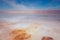 Beautiful view of salty Dead Sea shore with clear water and blue sky. Ein Bokek, Israel