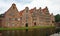 Beautiful view of Salzspeicher brick warehousesand river in old town, beautiful architecture, sunny day, Lubeck, Germany