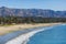 Beautiful view of Santa Barbara ocean front walk, with beach and marina, palms and mountains, Santa Ynez mountains and Pacific