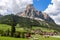 Beautiful view of the Sassongher mountain and an alpine village Corvara at the foot of the mountain