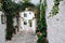 Beautiful view of scenic narrow alley with plants, Ostuni, Apulia, Italy