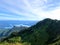 A beautiful view of the scenic ocean and forested mountains from on the top of mount raymond