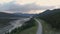 Beautiful View of Scenic Road by Glacial River at Sunset