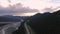 Beautiful View of Scenic Road by Glacial River at Sunset