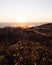 Beautiful view of the sea and a field on Apulia beach in Portugal at sunset