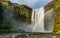 Beautiful view on Skogafoss Waterfall. Majestic nature of Iceland.  Travel concept. Artistic picture. Beauty world