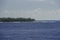 A beautiful view of a small Atoll in the middle of the south Pacific Ocean from the cruise ship deck while the officers and the
