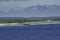 A beautiful view of a small Atoll in the middle of the south Pacific Ocean from the cruise ship deck while the officers and the