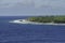 A beautiful view of a small Atoll in the middle of the south Pacific Ocean from the cruise ship deck while the officers and the