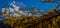 Beautiful view of the snowy rocky Alps under the blue sky in F