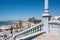 Beautiful view of the stairs that leads to the harbor with boats on a sunny day in Spain