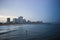 Beautiful view of a surfer in the sea with the Durban skyline in the background, South Africa