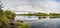 Beautiful view of the Te Rewa Rewa Bridge under a cloudy blue sky in New Plymouth, New Zealand