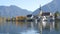 Beautiful view of the Tegernsee lake in Bavarian Alps. Old church by the lake and mountains