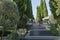 Beautiful view to big staircase of Aivazovsky landscape park in Crimea. Lot of evergreens cypresses, cedars and other nice plants