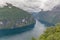 Beautiful view to Geiranger fjord, Atlantic ocean in cloudy weather selective focus