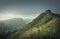 Beautiful view to the green hills in Hawaii, Oahu island. Hiking mountains landscape with vibrant tropical vegetation. Moody