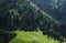 Beautiful view to the high green mountains and white kazakh national yurts, Almaty, Kazakhstan