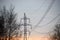 Beautiful view to powerful and huge high-voltage electricity poles, during sunset