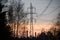 Beautiful view to powerful and huge high-voltage electricity poles, during sunset