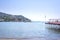 Beautiful view to Rapallo beach pier, blue sea and mountains