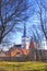 Beautiful view of the tower Oleviste Churchand the Fortress wall in Tallinn, Estonia