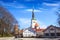 Beautiful view of the tower Oleviste Churchand the Fortress wall in Tallinn, Estonia