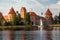 Beautiful view of Trakai Castle with Rainbow, Hot-air Balloons and Sailboat - Trakai, Lithuania