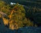 Beautiful view of trees and river from atop of a mountain during sunset in Norway