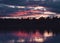 Beautiful view of the trees' silhouettes against the cloudy sky at sunset. Yellowknife, Canada.