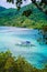 Beautiful view of a tropical island Snake with white traditional banca boat full tourists. El Nido, Palawan, Philippines