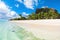 Beautiful view of tropical resort in Mauritius. Ocean, white sand, palms and blue sky