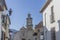 Beautiful view of the upper part of the church of Santa MarÃ­a de JesÃºs seen from an alley with white houses