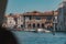 Beautiful view of the Venice river and buildings from a boat under a clear blue sky